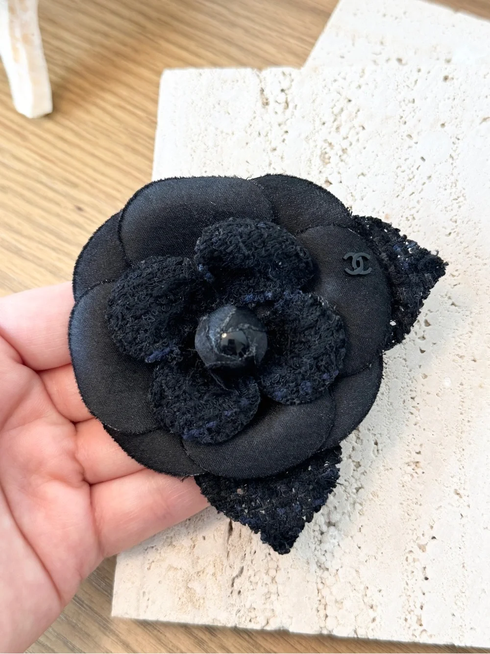 CHANEL Camélia Brooch crafted from black tweed/canvas